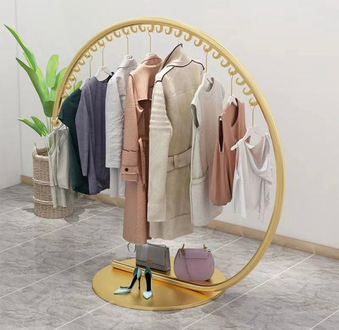 Modern Circular Clothes Hanger Rack - Space-Saving Garment Display Stand with Sturdy Base for Bedroom, Boutique, Retail Store - Durable Metal Clothing Organizer.
حامل تعليق ملابس دائري حديث - حامل عرض ملابس موفر للمساحة مع قاعدة متينة لغرفة النوم والبوتيك ومتجر التجزئة - منظم ملابس معدني متين