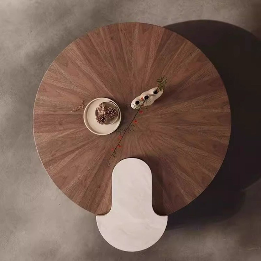 modern coffee table ; wood and marble table ; designer coffee table ; contemporary furniture ; luxury living room table ; round coffee table ; artistic coffee table ; statement furniture ; minimalist home decor ; high-end coffee table