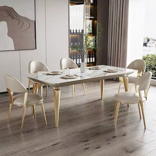luxury dining table set ; modern dining furniture ; marble top table ; gold leg dining table ; 6-seater dining set ; contemporary dining room ;  elegant dining chairs ; upholstered dining chairs ; gold and white table set ; chic dining furniture