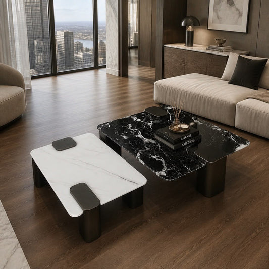 Luxury nesting coffee table set featuring a 90×90 cm black marble table and a 70×70 cm white marble table with sculptural metal bases and contemporary design.