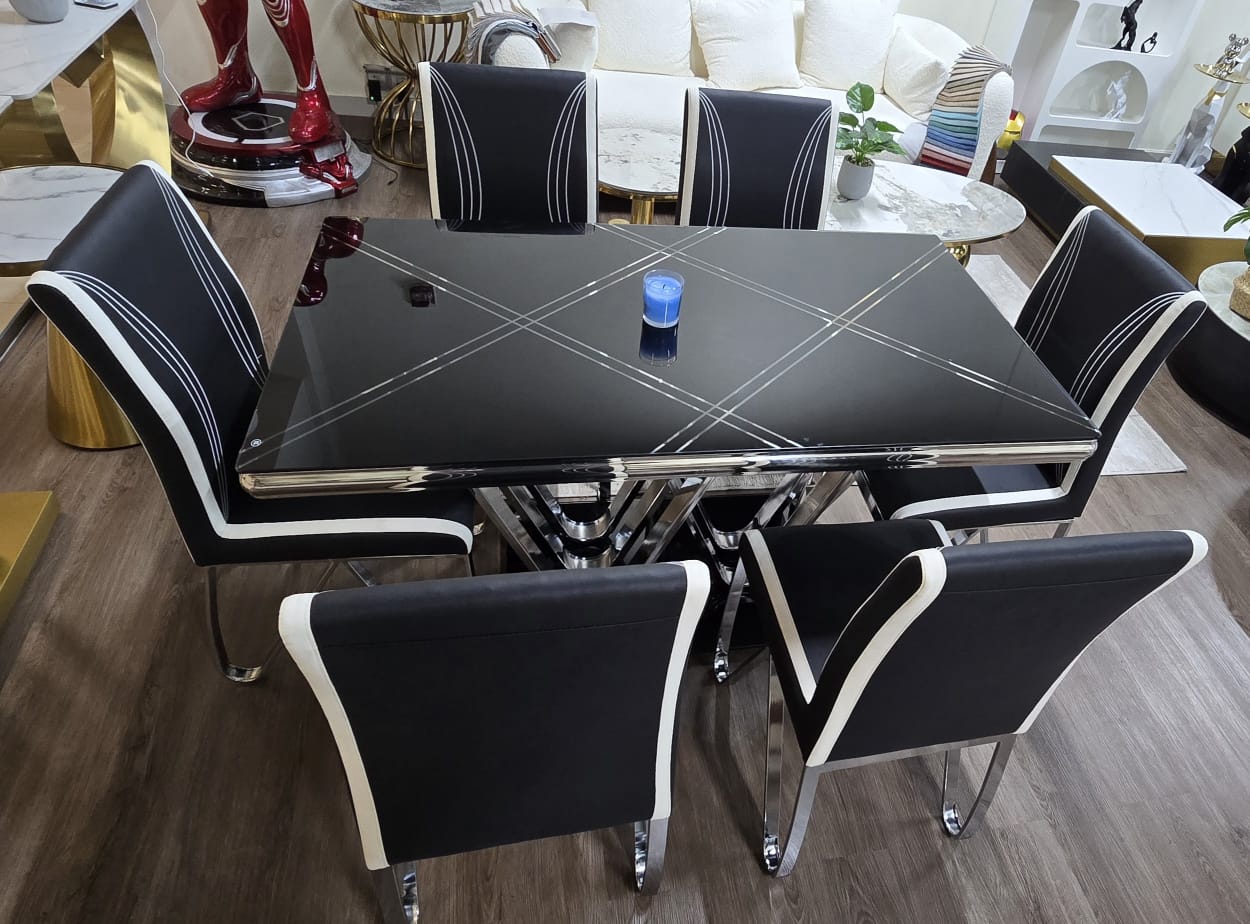 Tempered glass dining table with chairs ; Elegant contemporary dining set ; High-end dining furniture ; Black and white dining chairs set ; Stainless steel dining table ; Designer dining furniture set ; Chrome dining table with faux leather chairs
Dining Table with Chairs - Dining set - Dining room furniture - Dining Table and Chairs - Modern Dining Table Set - Compact dining table with chairs - Modern - Vintage - Luxury -6-seater dining table - Rectangular dining table - Contemporary dining table - Elegant